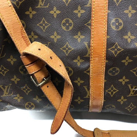 Louis Vuitton travel bag with monograms